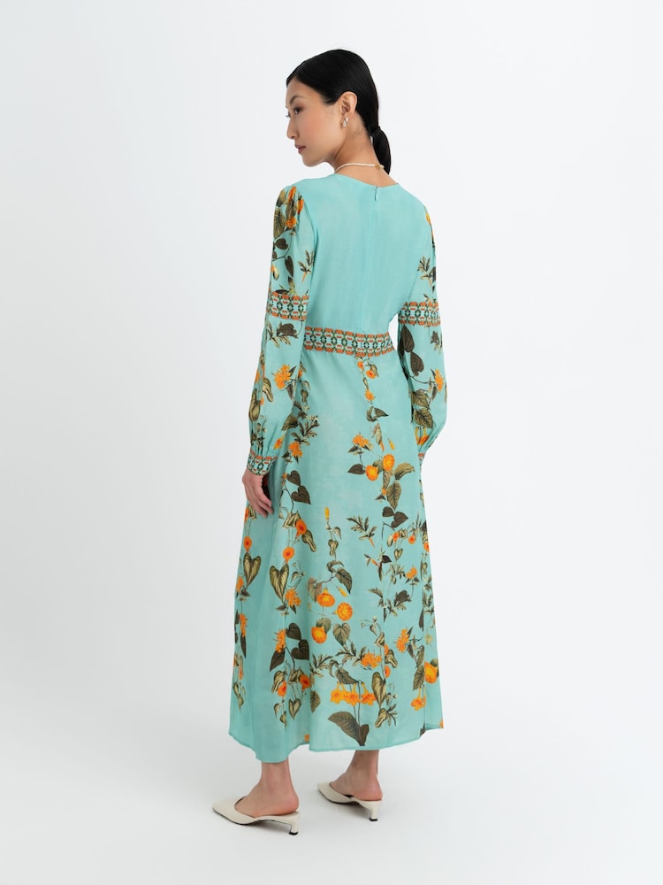 Raishma Blue Elsa Is A Sophisticated Midi Dress Featuring A Deep V-Neckline Long Statement Sleeves And A Flowing Silhouette - Image 2 of 3 Raishma Blue Elsa Is A Sophisticated Midi Dress Featuring A Deep V-Neckline Long Statement Sleeves And A Flowing Silhouette - Image 2 of 3