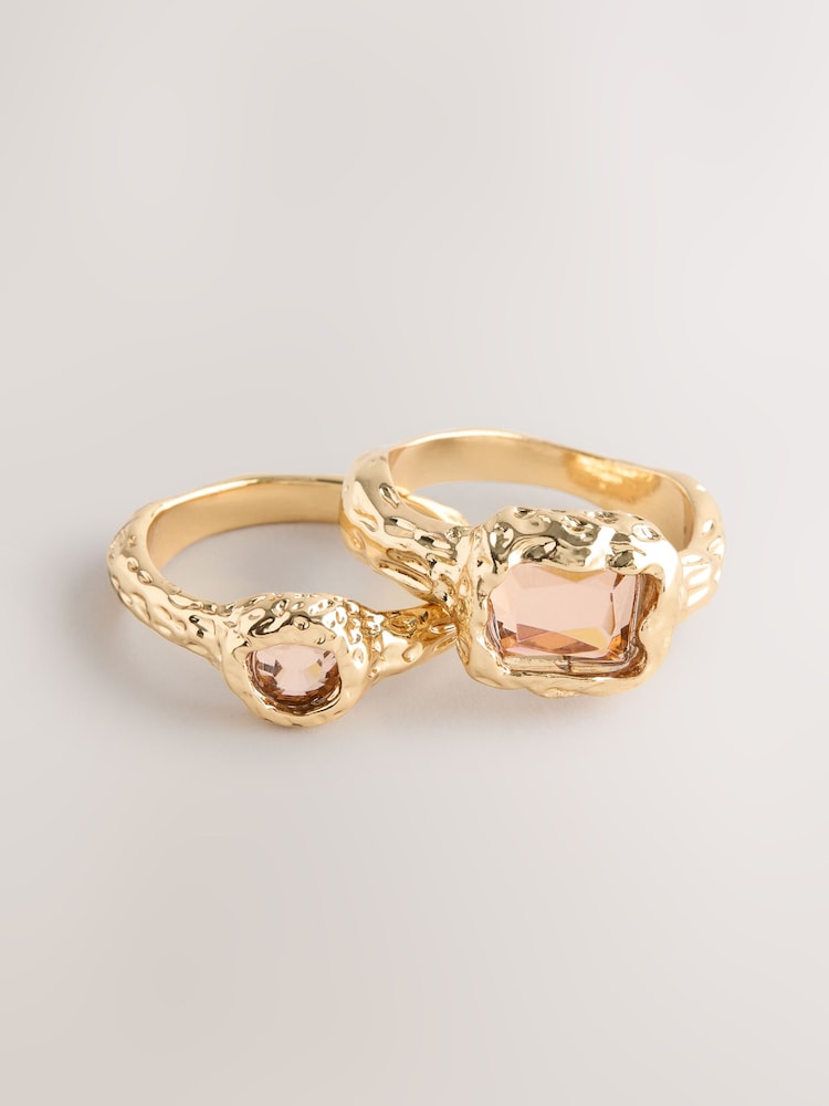 Gold Tone Hammered Pink Sparkle Rings 2 Pack - Image 1 of 3 Gold Tone Hammered Pink Sparkle Rings 2 Pack - Image 1 of 3