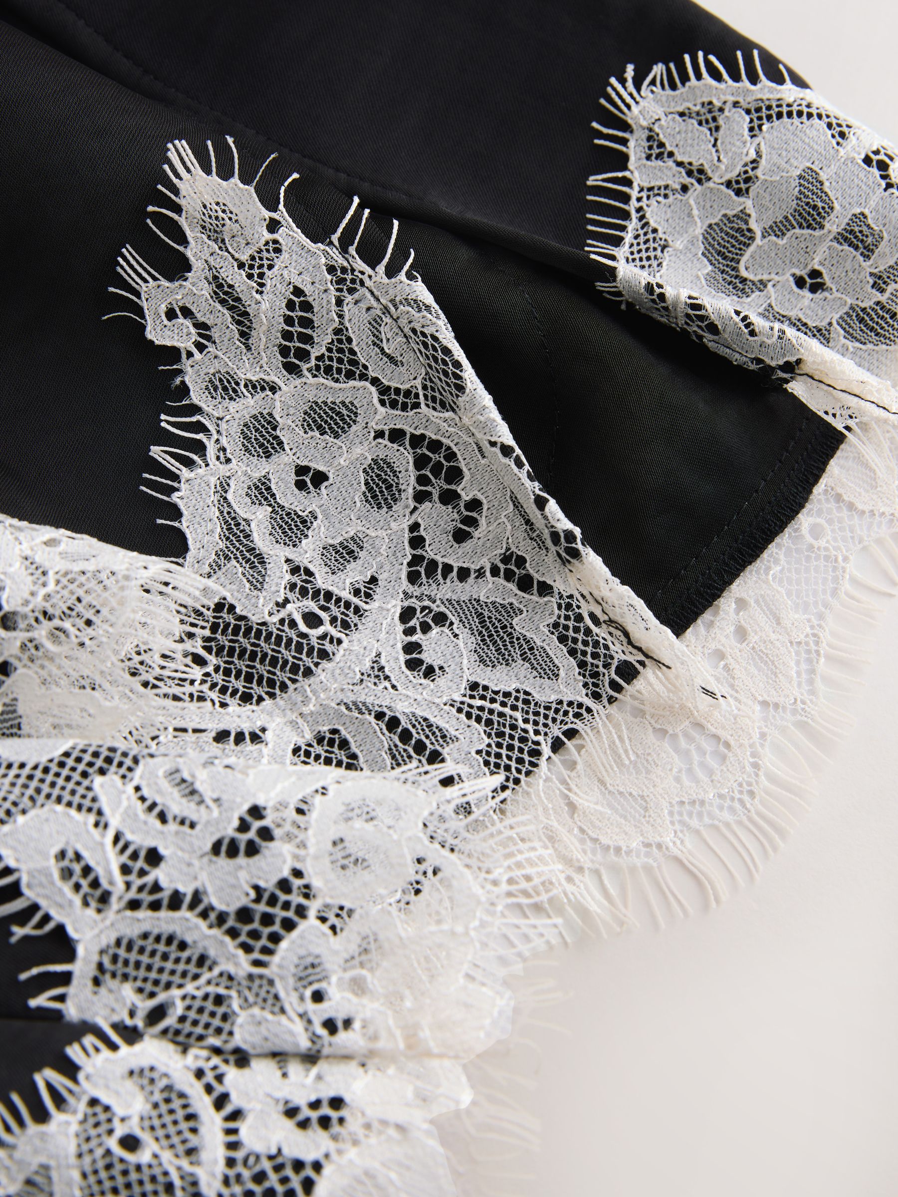 Buy Black/Cream Asymmetric Hem Lace Cami Top from Next Romania