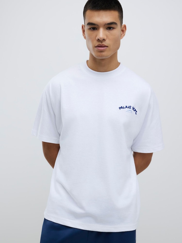 River Island White Oversized Fit Palais Dept Embroidered T-Shirt - Image 1 of 4 River Island White Oversized Fit Palais Dept Embroidered T-Shirt - Image 1 of 4