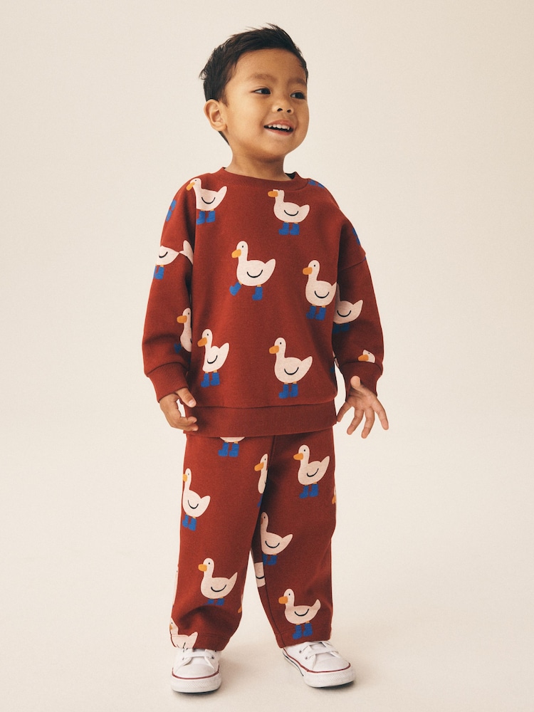 Burgundy Red All Over Print Crew Neck Sweat Top and Joggers Set (3mths-7yrs) - Image 1 of 10 Burgundy Red All Over Print Crew Neck Sweat Top and Joggers Set (3mths-7yrs) - Image 1 of 10