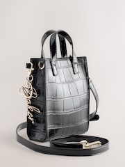 Bolso bandolera infantil negro con estampado de cocodrilo y lazo de Baker by Ted Baker - Imagen 3 de 6
