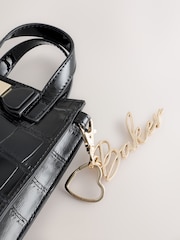 Bolso bandolera infantil negro con estampado de cocodrilo y lazo de Baker by Ted Baker - Imagen 6 de 6