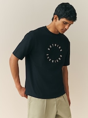 Nothing Ordinary Black Master Font Circle Relaxed Fit Graphic Heavyweight T-Shirt - Image 1 of 5