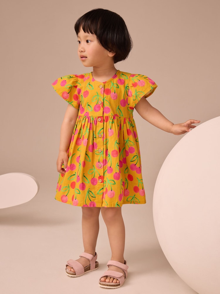 Ochre Yellow Cherry Print Button Up Summer Dress (3mths-10yrs) - Image 1 of 2 Ochre Yellow Cherry Print Button Up Summer Dress (3mths-10yrs) - Image 1 of 2