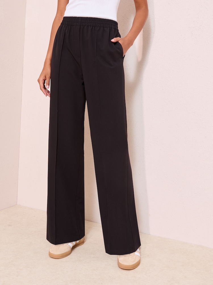 Friends Like These Black Crinkle Jersey Wide Leg Trousers - Image 1 of 5