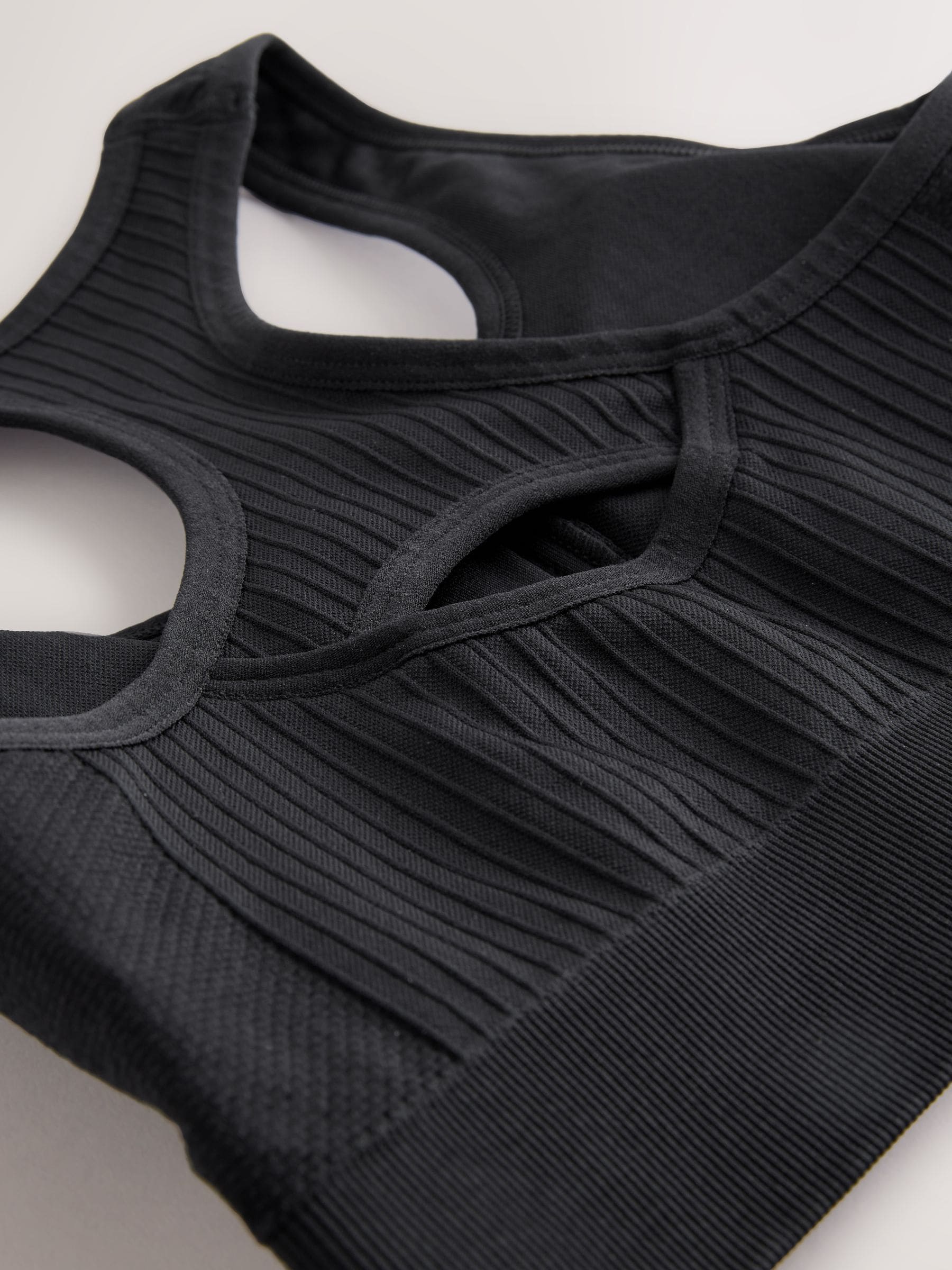 Buy Black Seamless Zip Front Medium Impact Sports Bra from Next USA