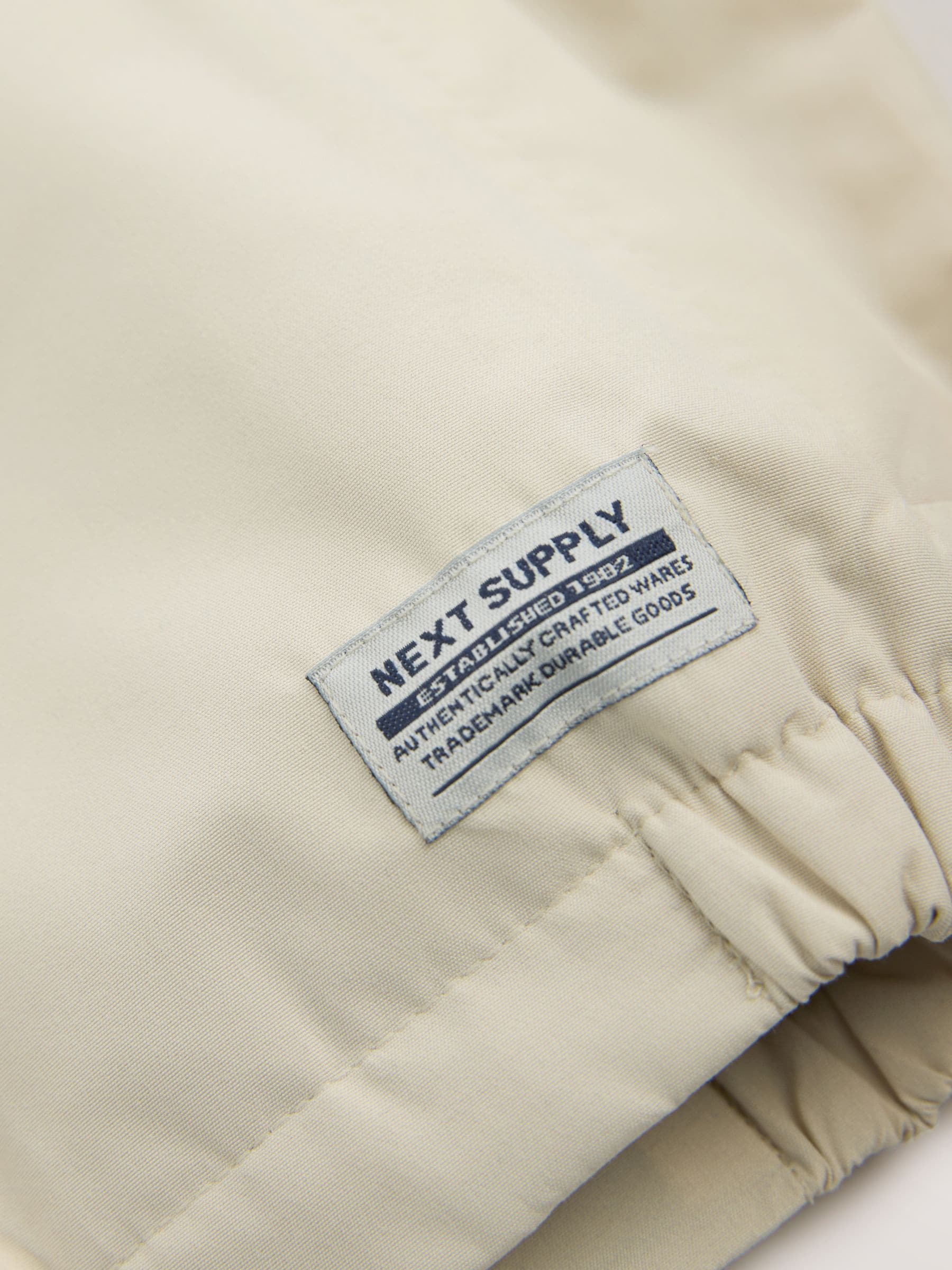 Cumpără Alb-gălbui - Jachetă impermeabilă Cagoule (3luni-7ani