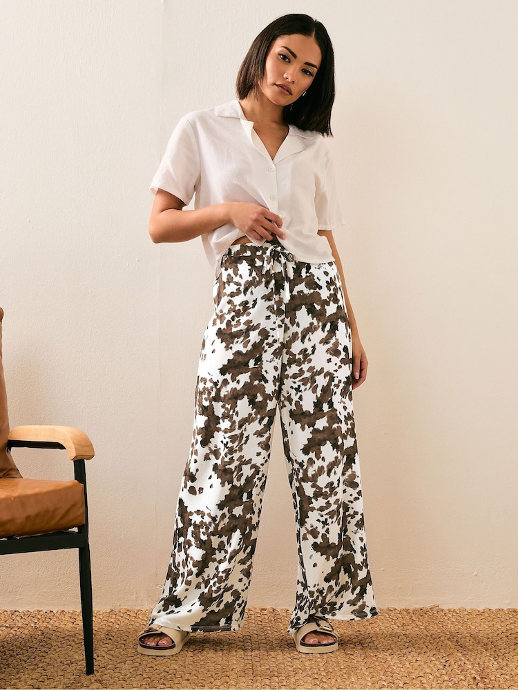 PixieGirl Petite Brown Cow Print Wide Leg Trousers - Image 1 of 6