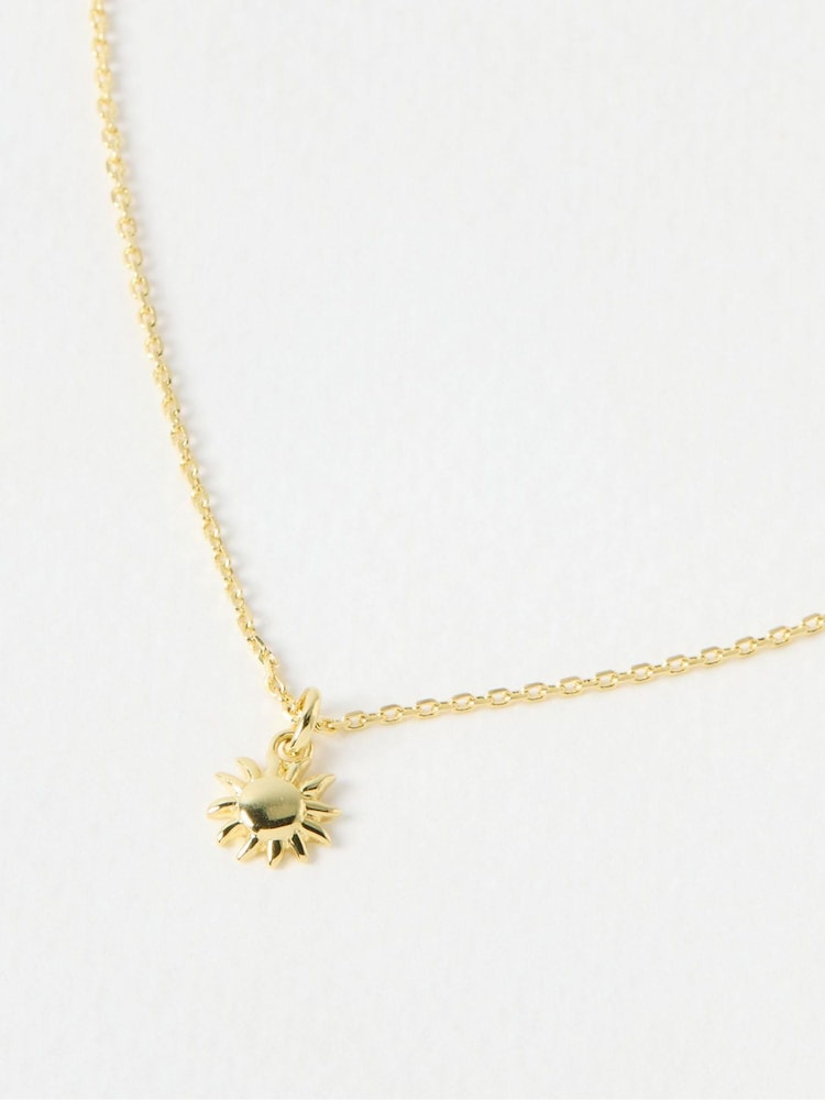 Oliver Bonas Gold Tone Elio Sun Charm Pendant Necklace - Image 1 of 4