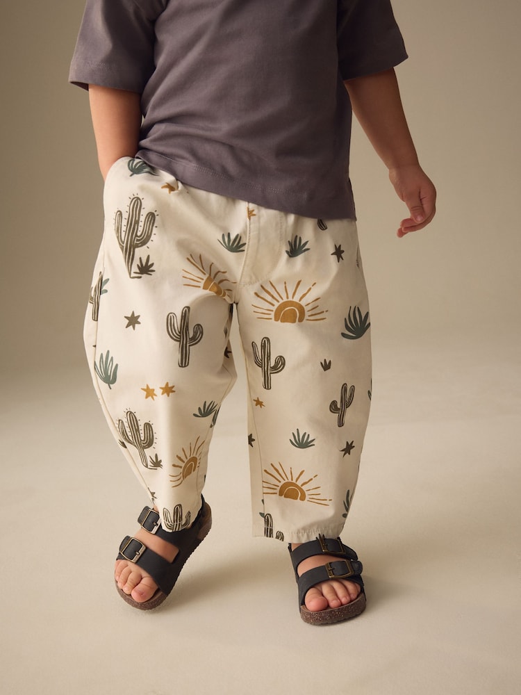 Neutral Cactus Print Barrel Pull On Trousers (3mths-7yrs) (3mths-7yrs) - Image 1 of 4 Neutral Cactus Print Barrel Pull On Trousers (3mths-7yrs) (3mths-7yrs) - Image 1 of 4