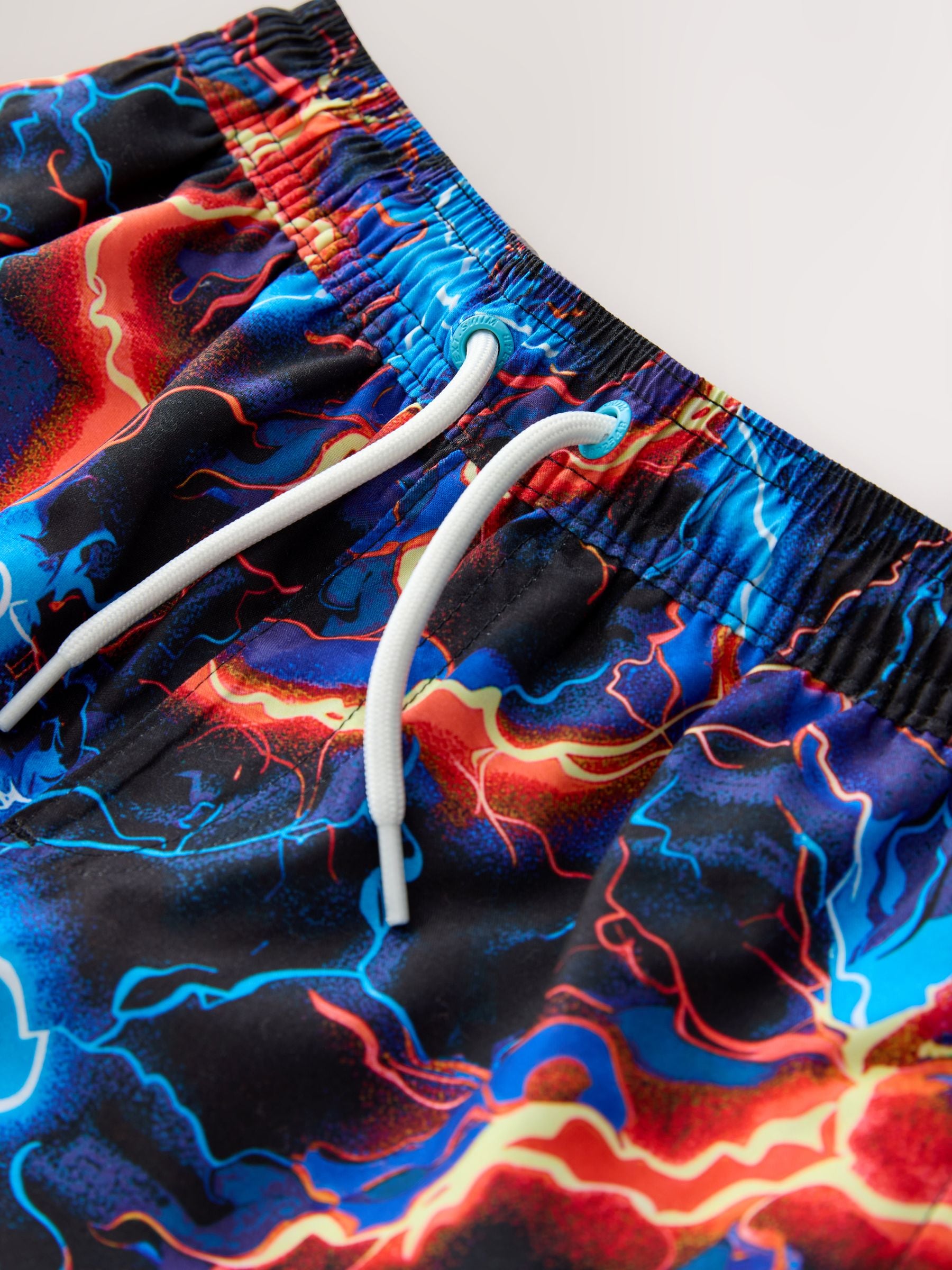 Buy Black Lightening Bolt Printed Swim Shorts (3-16yrs) from Next USA
