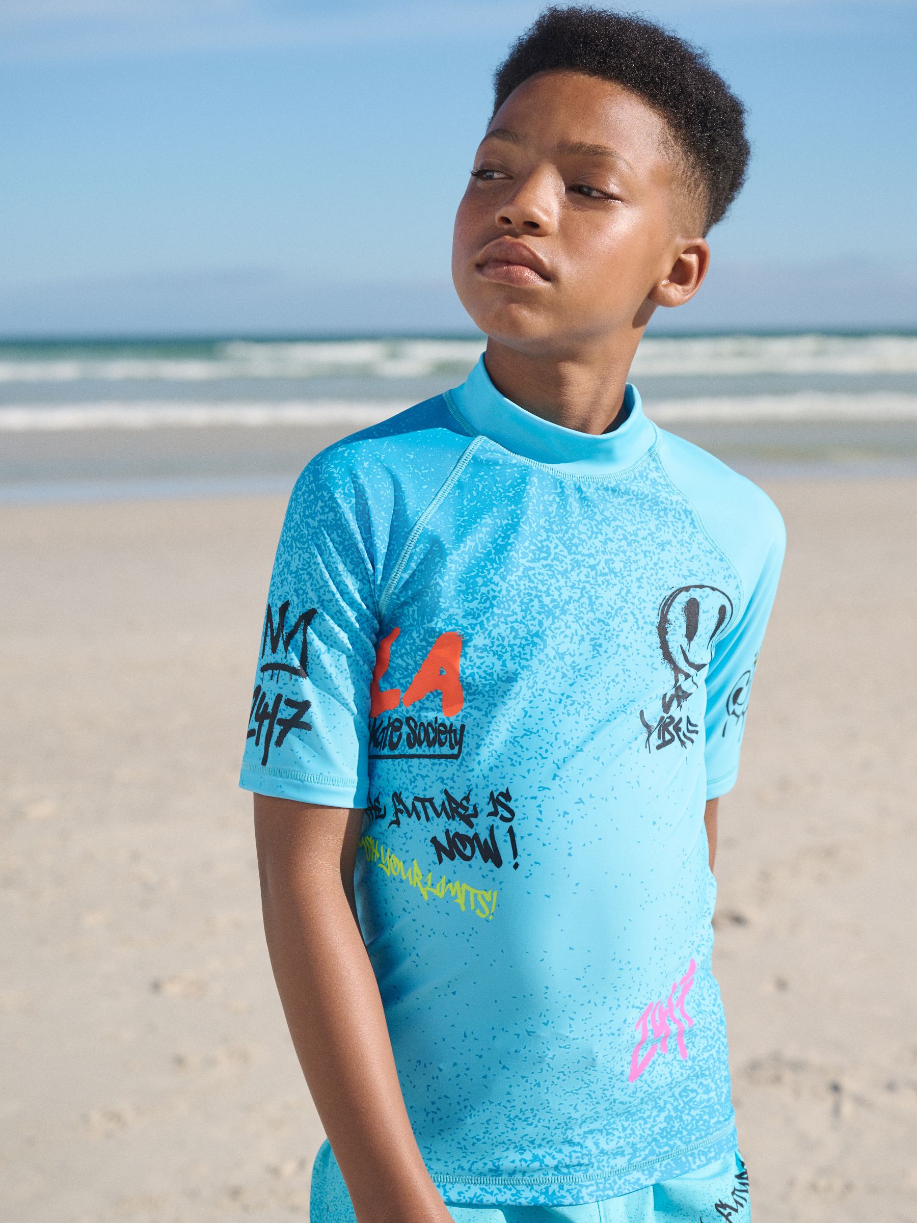 Buy Blue Graffiti Short Sleeve Rash Vest (1.5-16yrs) from the Next