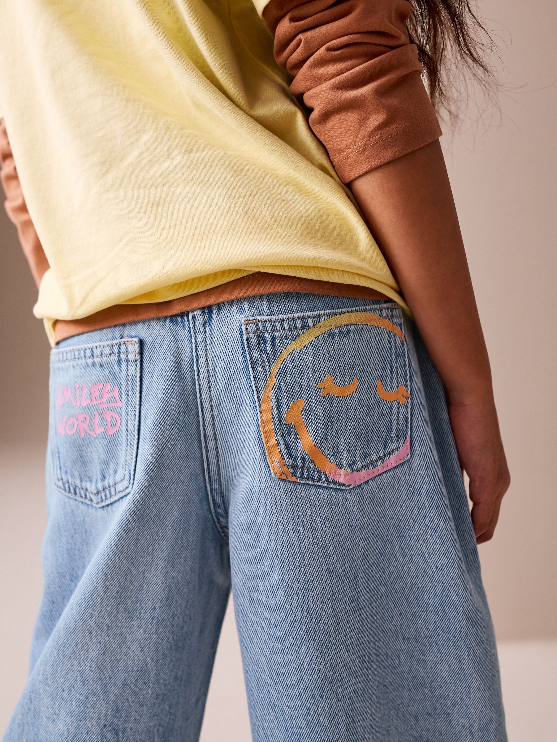 Buy Mid Blue SmileyWorld® Print Wide Leg Jeans (3-16yrs) from Next USA