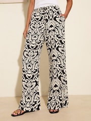 Friends Like These Black Floral Crinkle Jersey Wide Leg Trousers - Image 1 of 4