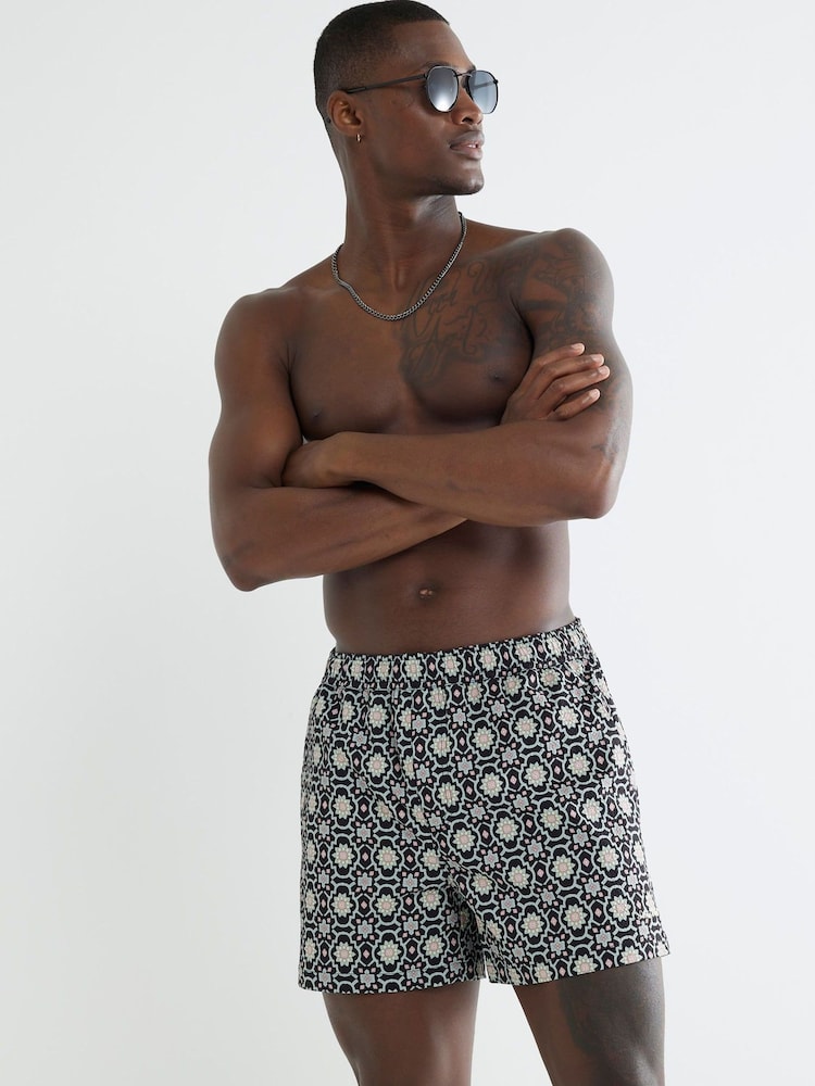 River Island Black Multi Colour Geo Print Swim Shorts - Image 1 of 4