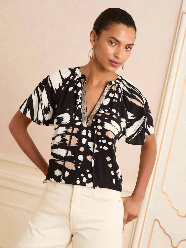 Love & Roses Animal Black/White Sequin V-Neck Blouse - Image 1 of 4