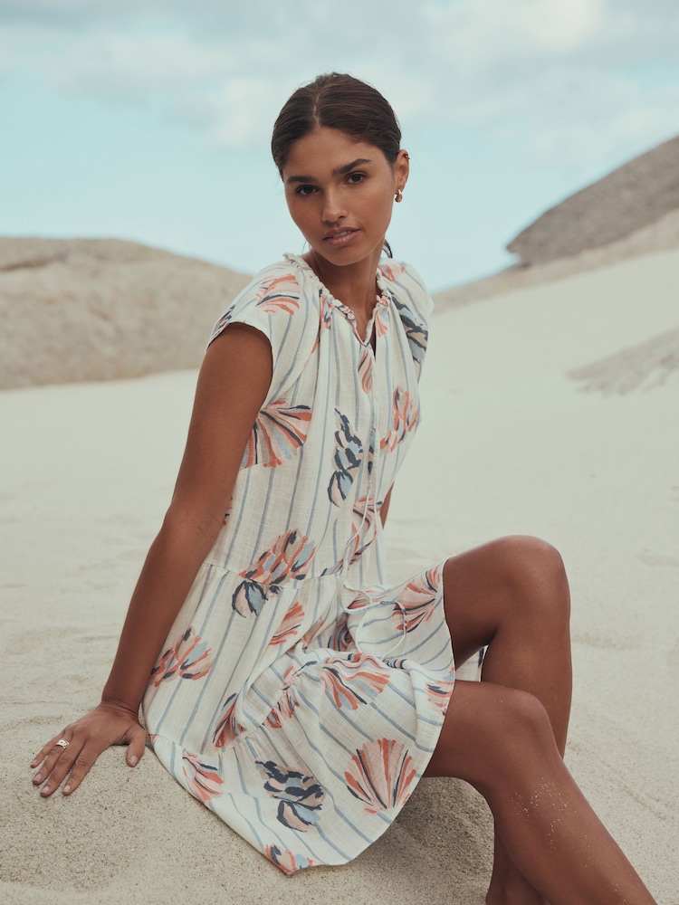 Blue/Pink Shell Print V-Neck Tiered Mini Dress with Linen - Image 1 of 4 Blue/Pink Shell Print V-Neck Tiered Mini Dress with Linen - Image 1 of 4