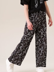 Angel & Rocket Black Fleur Printed Wide Leg Trousers - Image 1 of 7