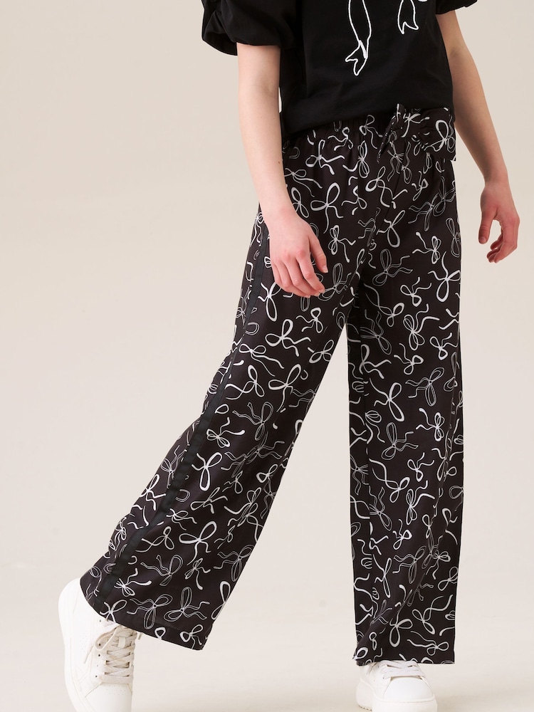 Angel & Rocket Black Fleur Printed Wide Leg Trousers - Image 1 of 7