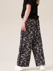 Angel & Rocket Black Fleur Printed Wide Leg Trousers - Image 4 of 7