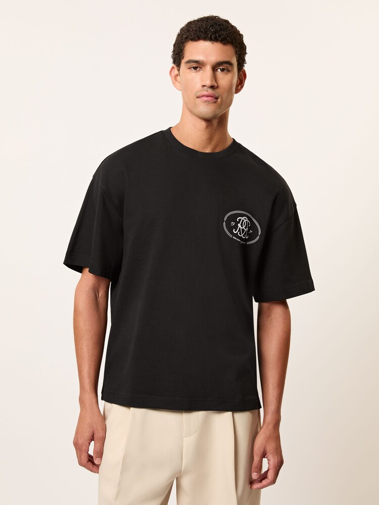 Reiss Black Cuthbert Monogram Print Cotton Oversized T-Shirt - Image 1 of 6 Reiss Black Cuthbert Monogram Print Cotton Oversized T-Shirt - Image 1 of 6