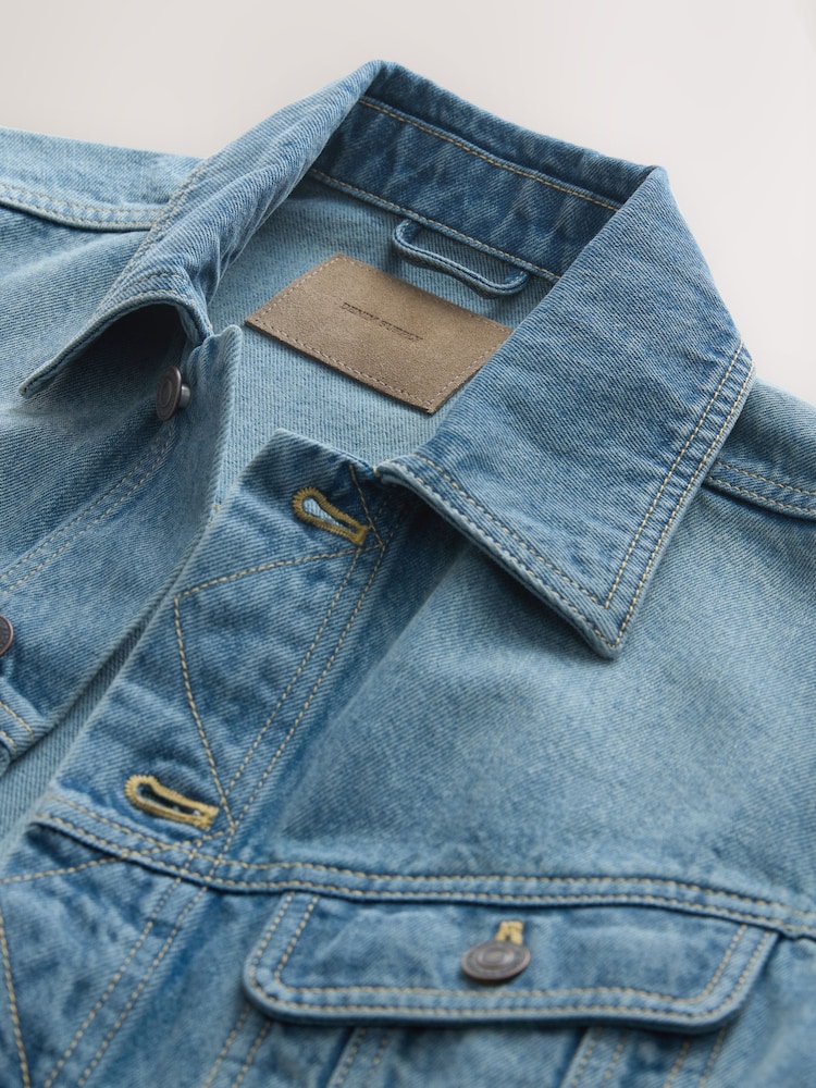 Polo bleu uni en coton avec un col boutonné et une coupe droite