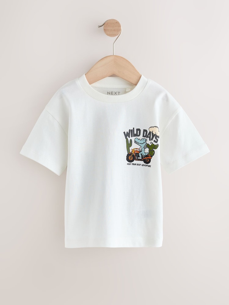 White Dinosaur Oversized - تيشرت بكُم قصير مزين بطبعة على الظهر (3 شهور-7 سنوات) - صورة 1 من 4 White Dinosaur Oversized - تيشرت بكُم قصير مزين بطبعة على الظهر (3 شهور-7 سنوات) - صورة 1 من 4