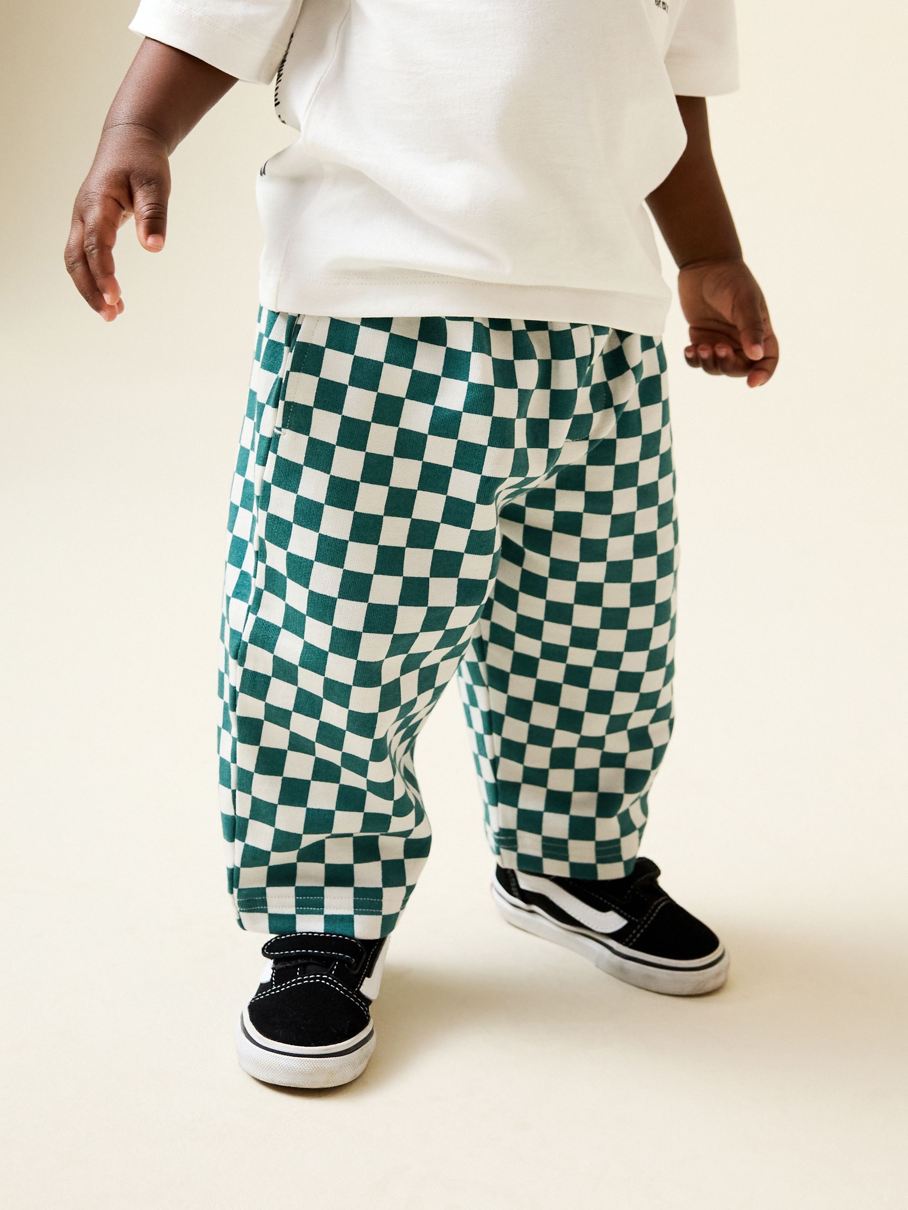 Buy Green/White Checkerboard Single Wide Leg Jersey Joggers (3mths