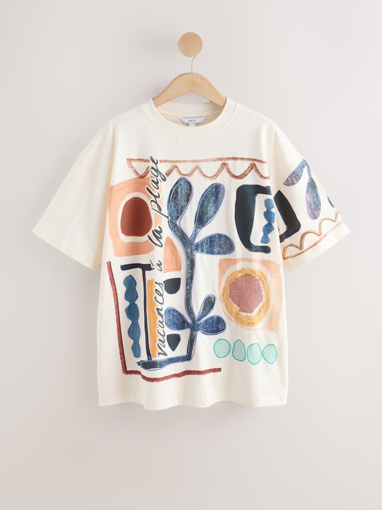 كريم - تيشرت للشاطئ بطبعة جرافيك - صورة 1 من 3 كريم - تيشرت للشاطئ بطبعة جرافيك - صورة 1 من 3