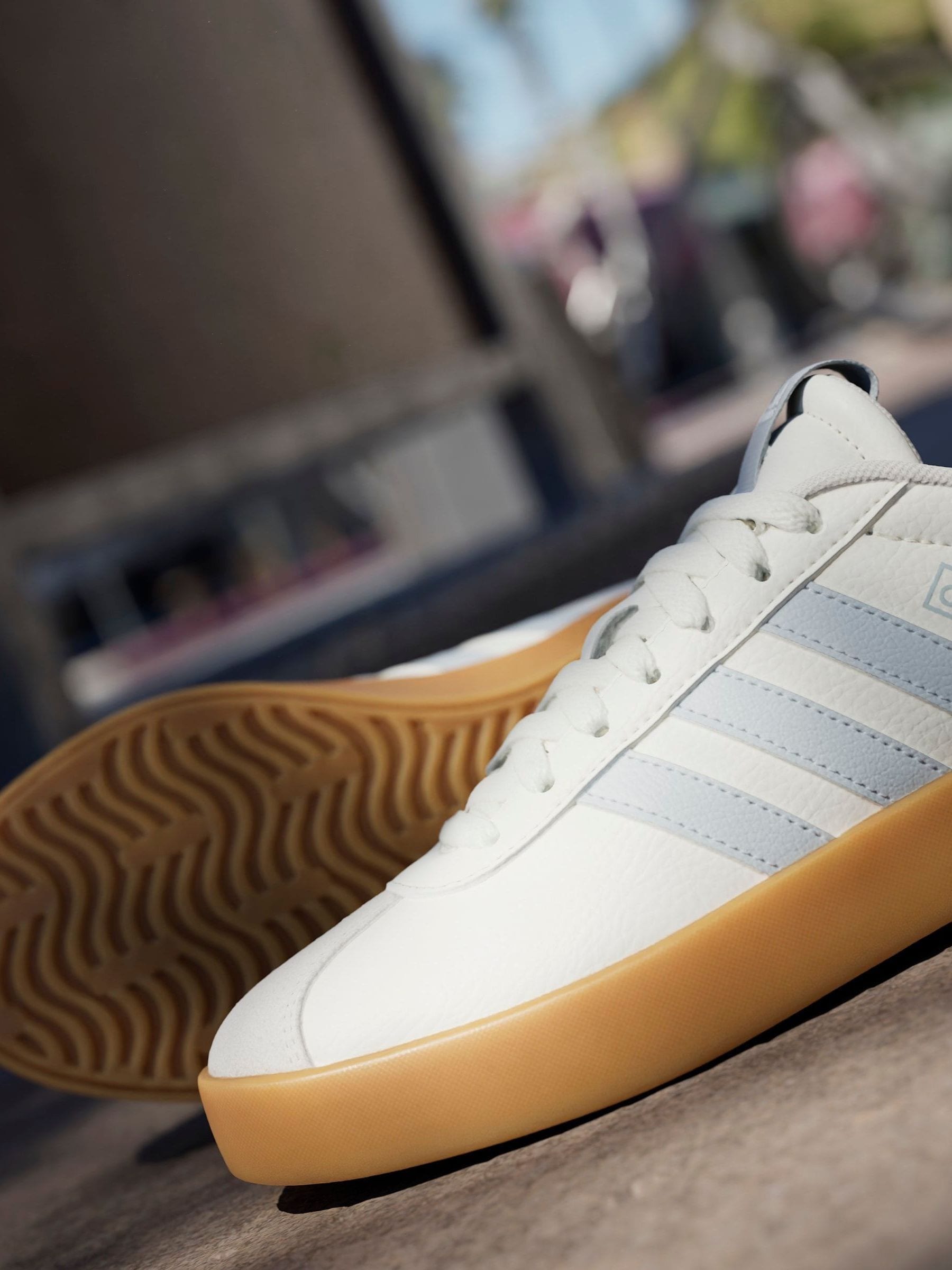 white adidas shoes with brown soles