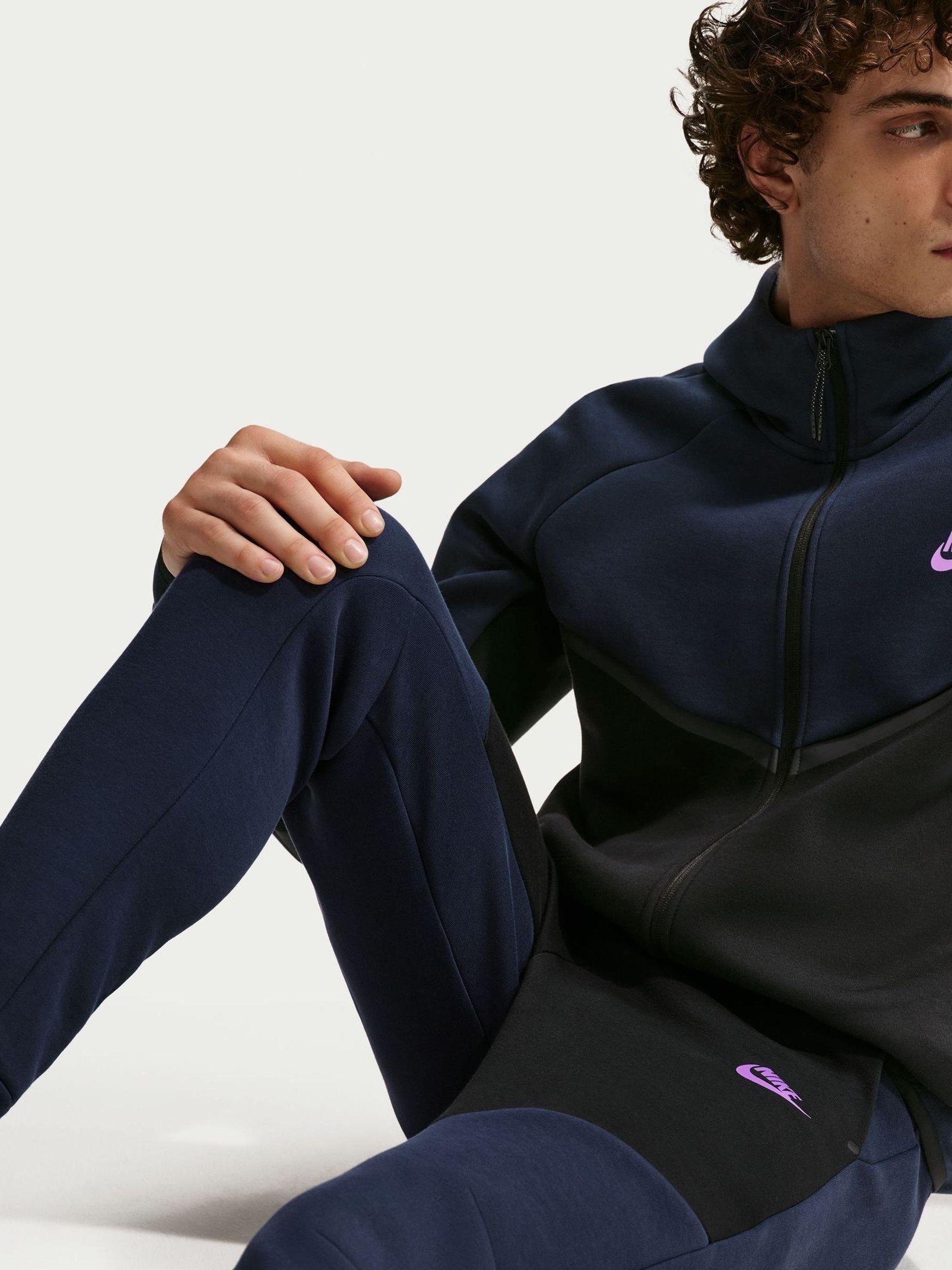 purple and black nike tech