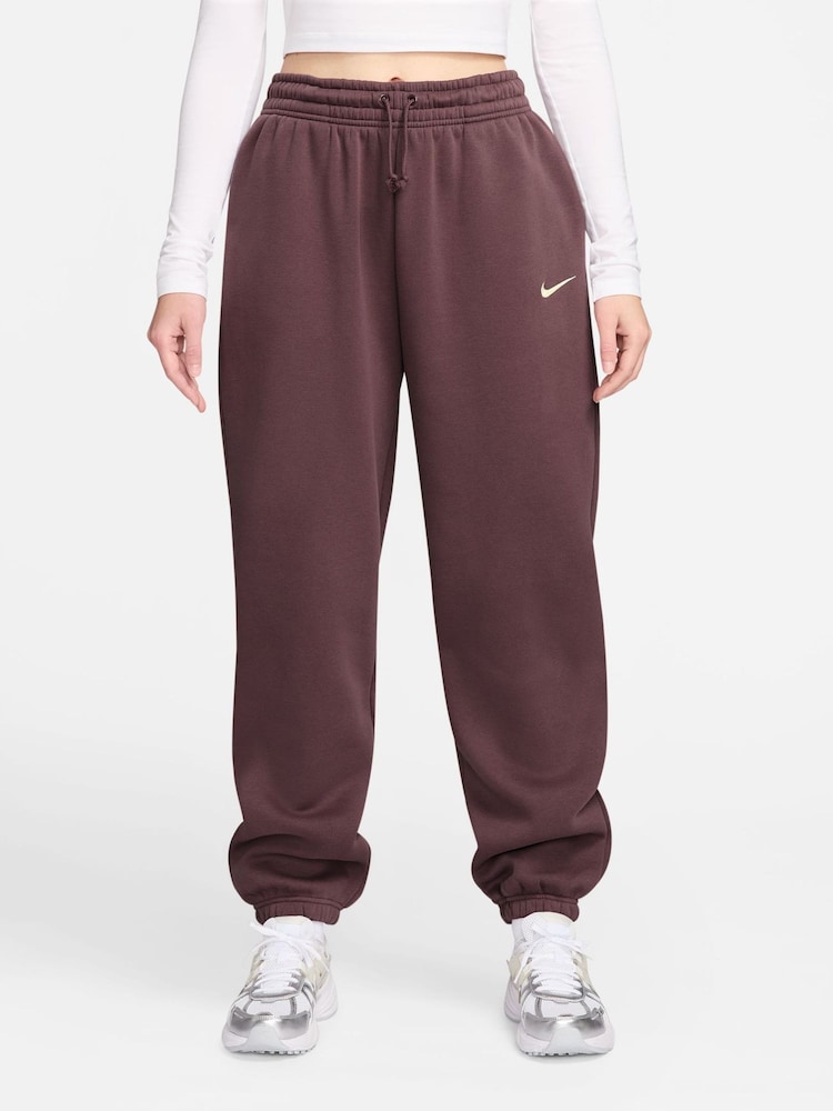 Nike Tattoo Brown Oversized Phoenix Fleece High Waisted Joggers - Image 1 of 5 Nike Tattoo Brown Oversized Phoenix Fleece High Waisted Joggers - Image 1 of 5