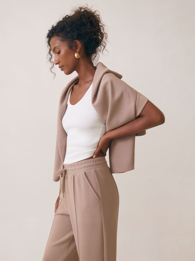 Reiss Taupe Neutral Jemma Petite Modal-Blend Interlock Wide-Leg Joggers - Image 1 of 7 Reiss Taupe Neutral Jemma Petite Modal-Blend Interlock Wide-Leg Joggers - Image 1 of 7