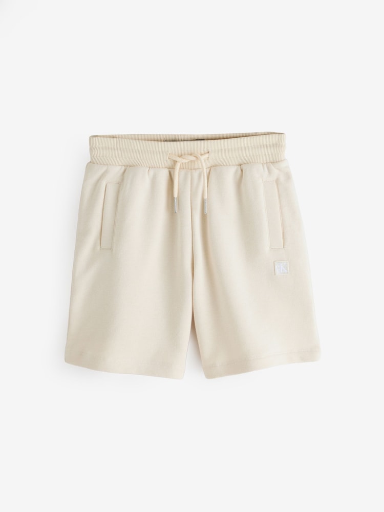 Calvin Klein Cream Mini Badge Shorts - Image 1 of 1 Calvin Klein Cream Mini Badge Shorts - Image 1 of 1