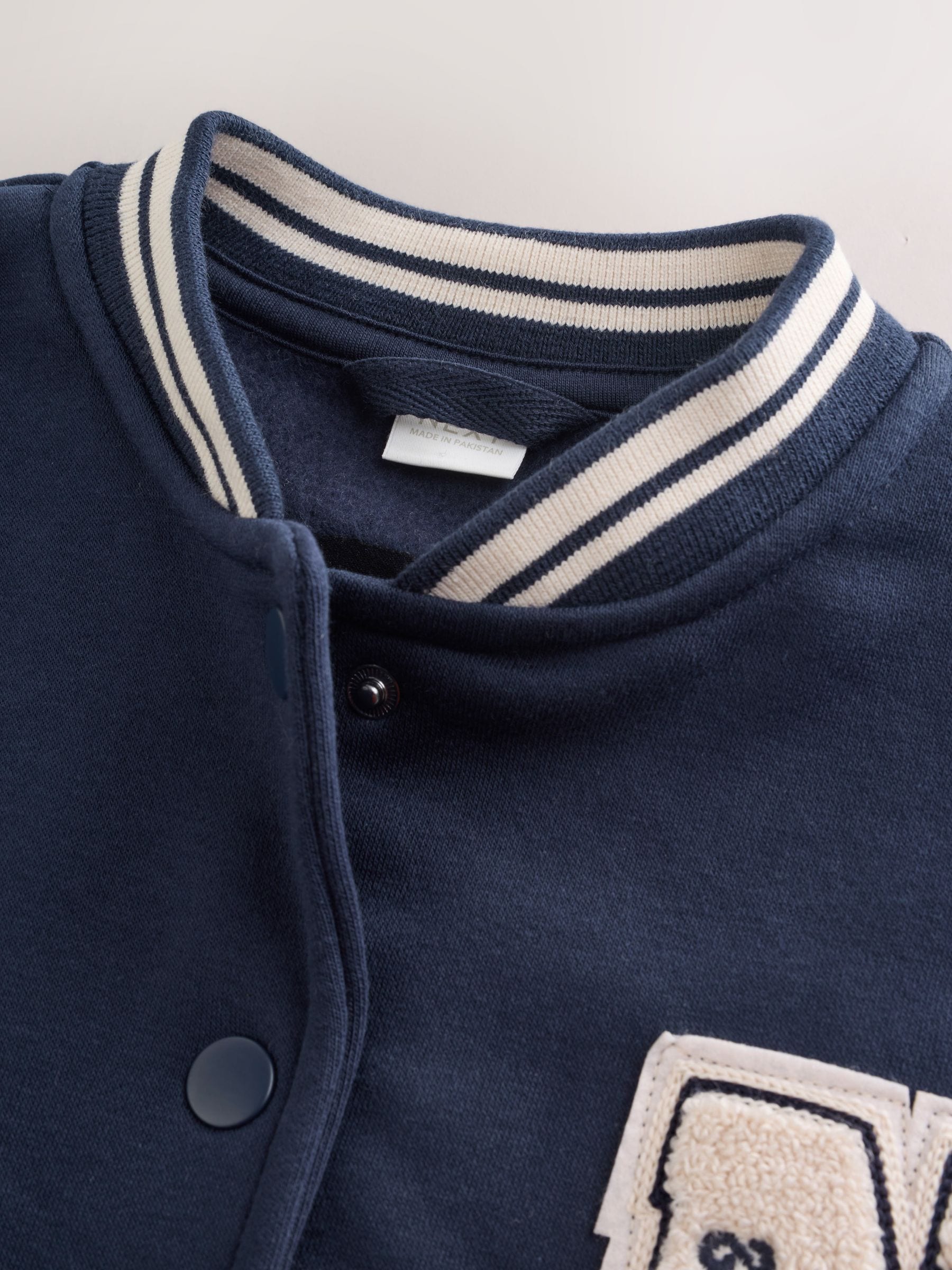 Buy Navy Varsity Embroidered Jacket (3-16yrs) from Next USA
