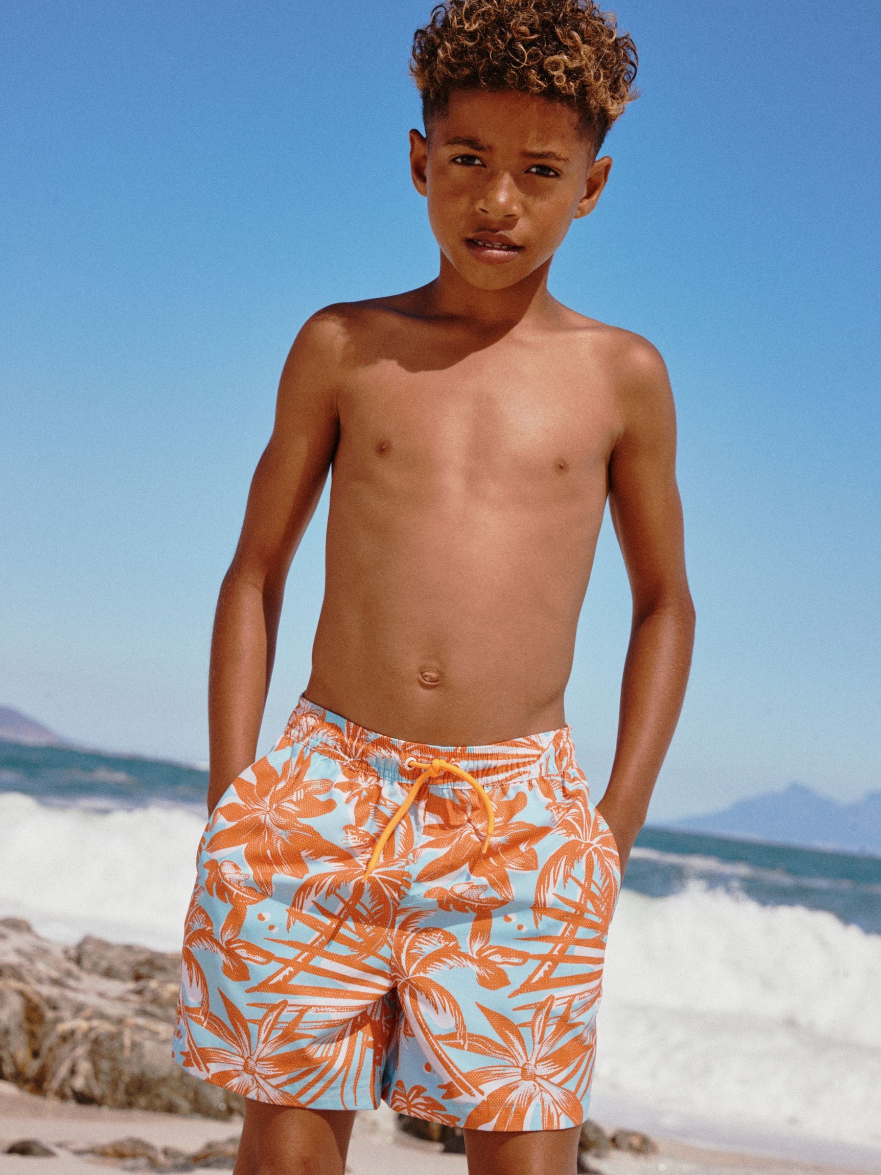 Buy Orange Tropical Printed Swim Shorts (3-16yrs) from Next