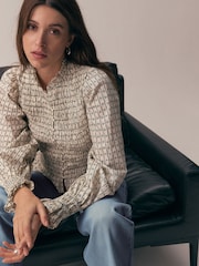 Ecru Ditsy Floral Print Smocked Button Front Long Sleeve Blouse - Image 1 of 5