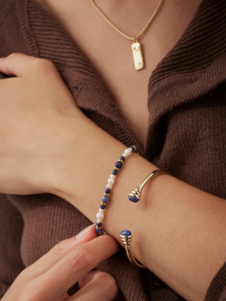 Estella Bartlett Gold Tone Waterprooof Cabochon Lapis Lazuli Open Bangle - Image 2 of 3 Estella Bartlett Gold Tone Waterprooof Cabochon Lapis Lazuli Open Bangle - Image 2 of 3