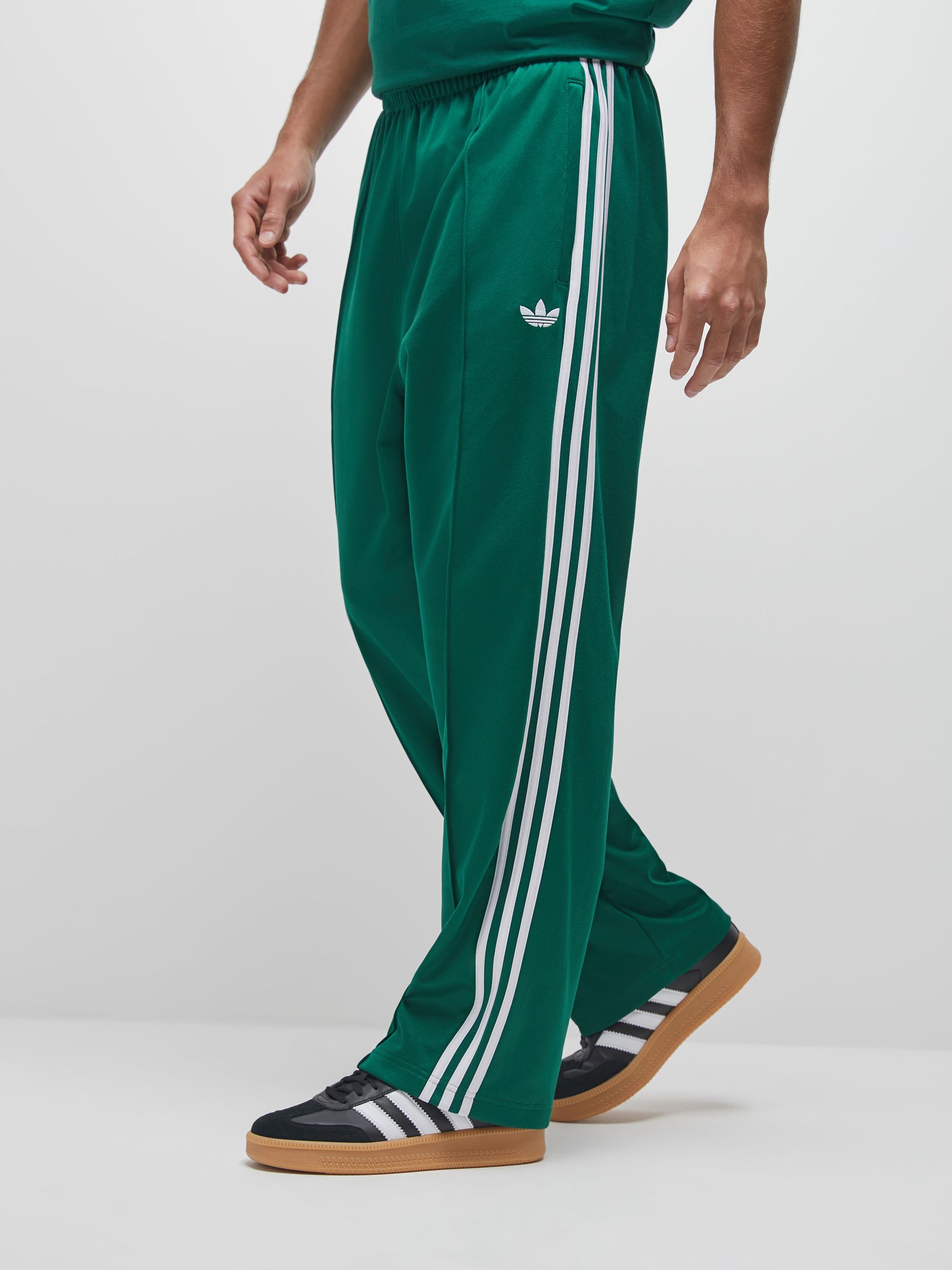 Buy adidas Originals Green Baggy Track Joggers from Next USA