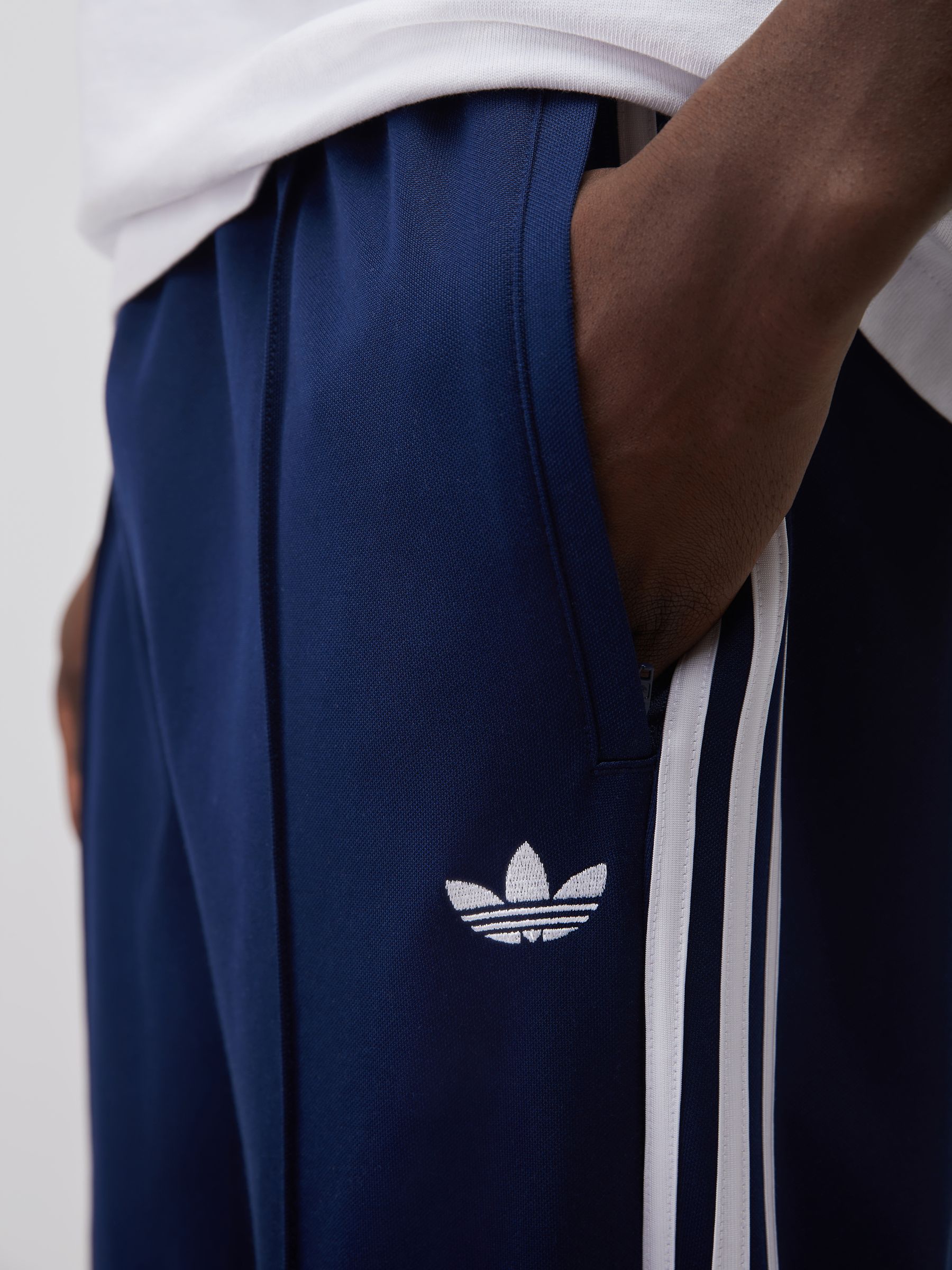 Buy adidas Originals Blue Baggy Track Joggers from Next USA