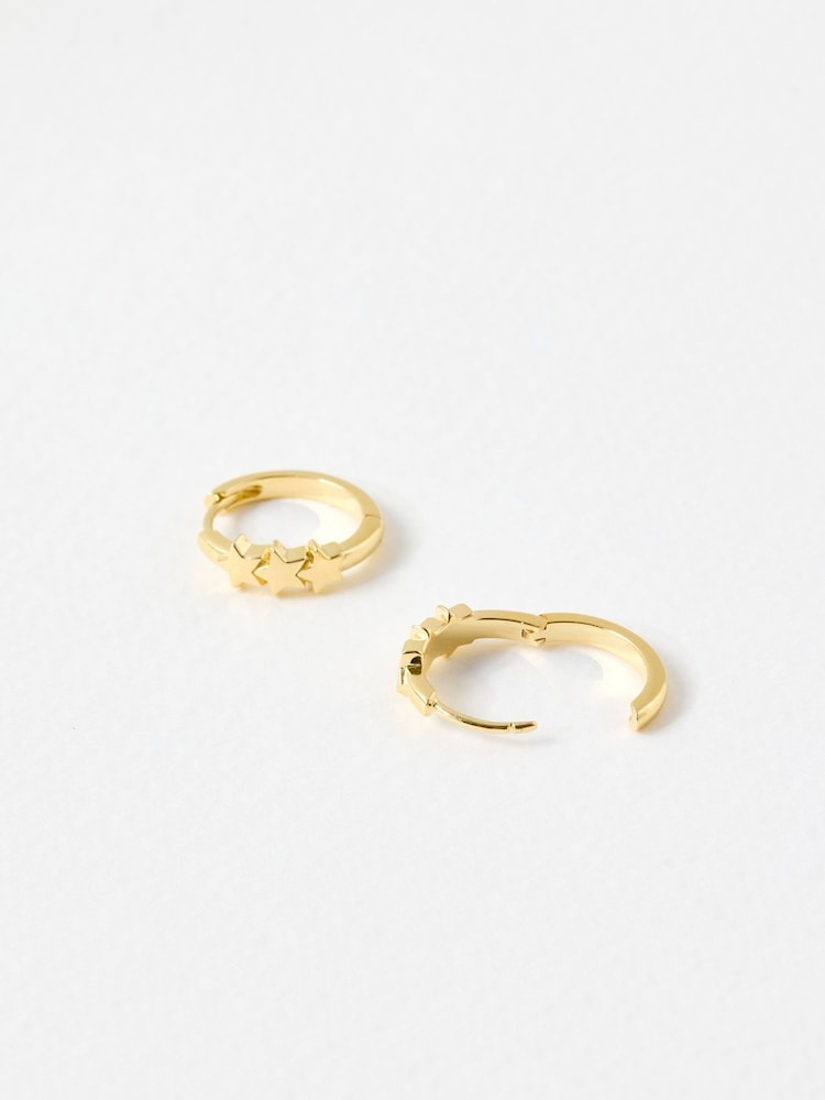 Oliver Bonas Gold Tone Tiny Triple Star Huggie Earrings - Image 2 of 3 Oliver Bonas Gold Tone Tiny Triple Star Huggie Earrings - Image 2 of 3