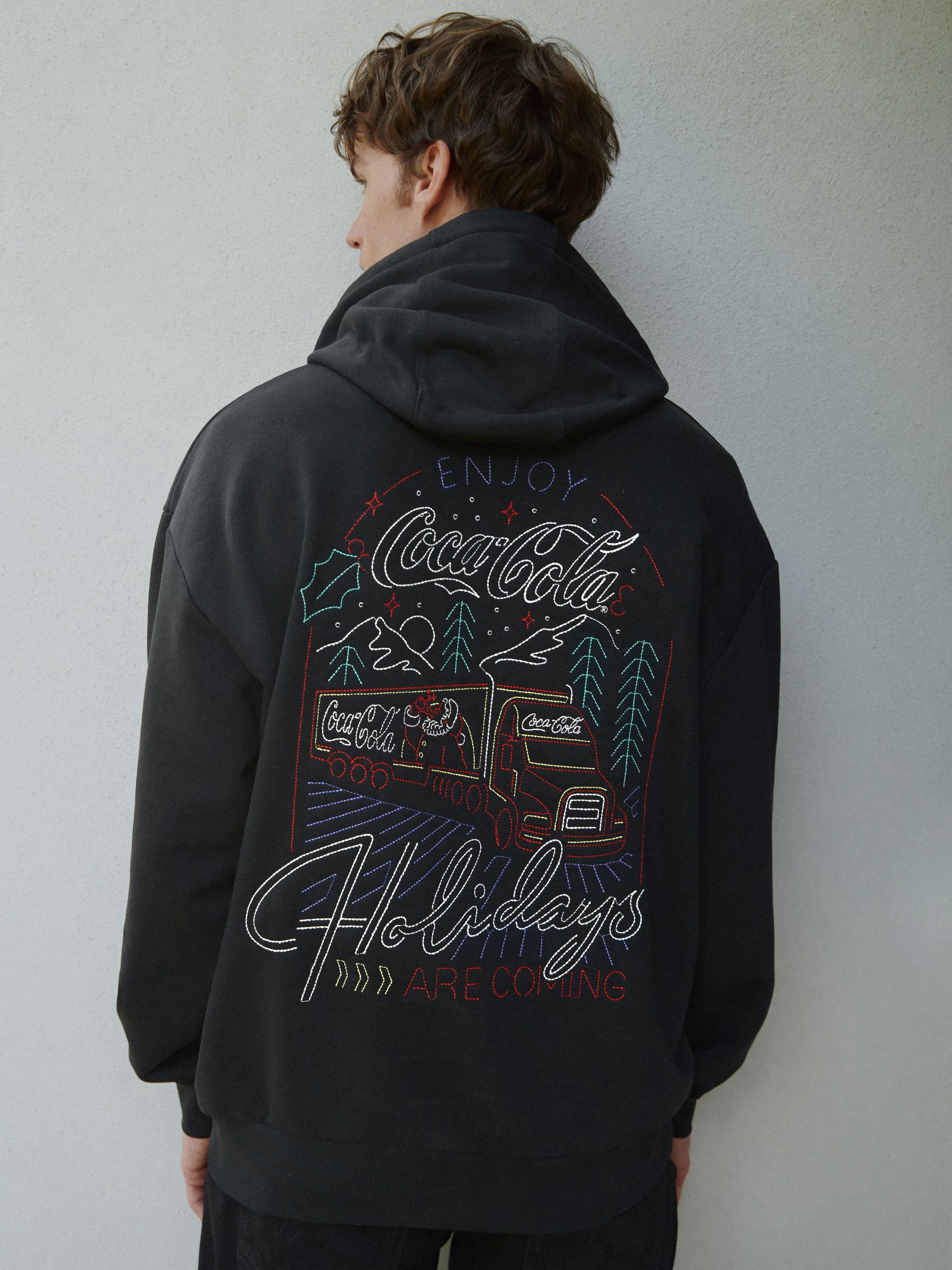 Buy Black Christmas Coca Cola Graphic License Hoodie from the Next