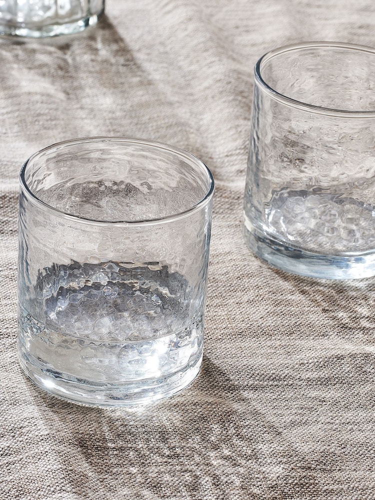 Nkuku Clear Yala Hammered Tumbler Glass - Image 1 of 2 Nkuku Clear Yala Hammered Tumbler Glass - Image 1 of 2