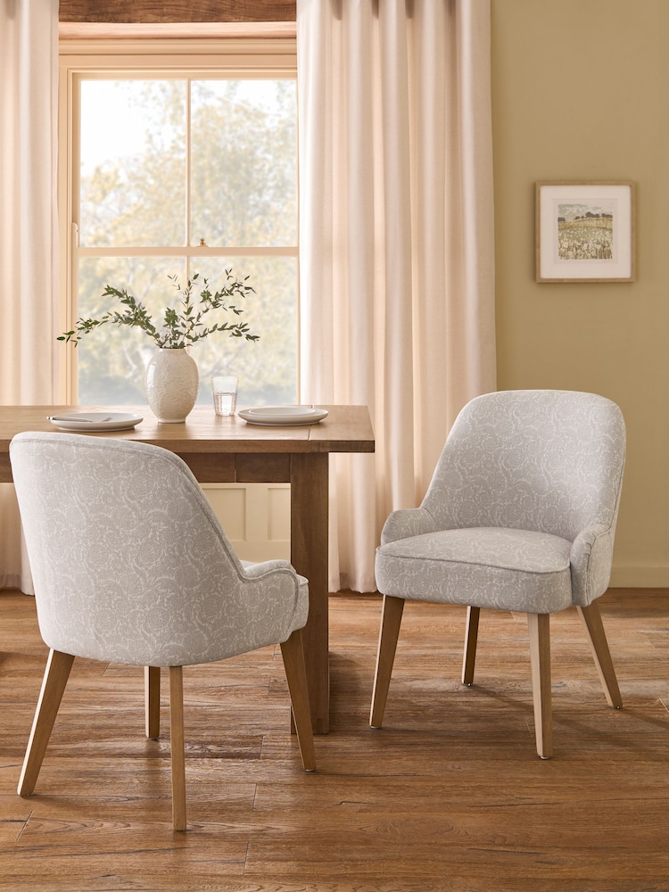 Set of 2 Relaxed Linen Look Floral Print Light Natural Hensley Oak Effect Leg Dining Chairs - Image 1 of 9 Set of 2 Relaxed Linen Look Floral Print Light Natural Hensley Oak Effect Leg Dining Chairs - Image 1 of 9