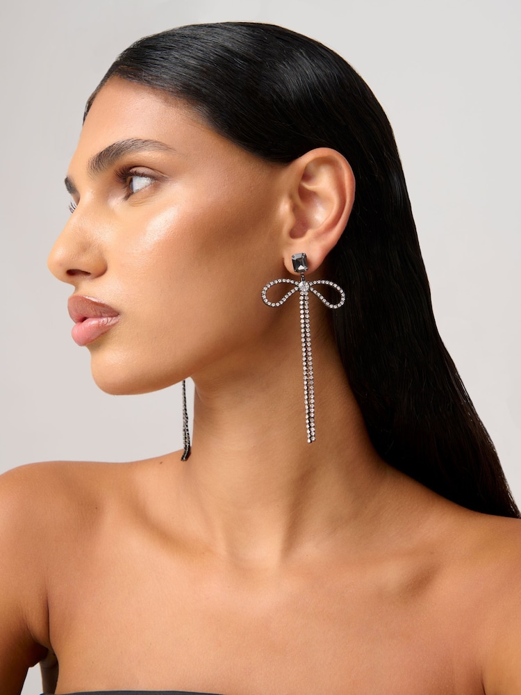 Aela Statement Sparkle Bow Drop Black Earrings - Image 1 of 3