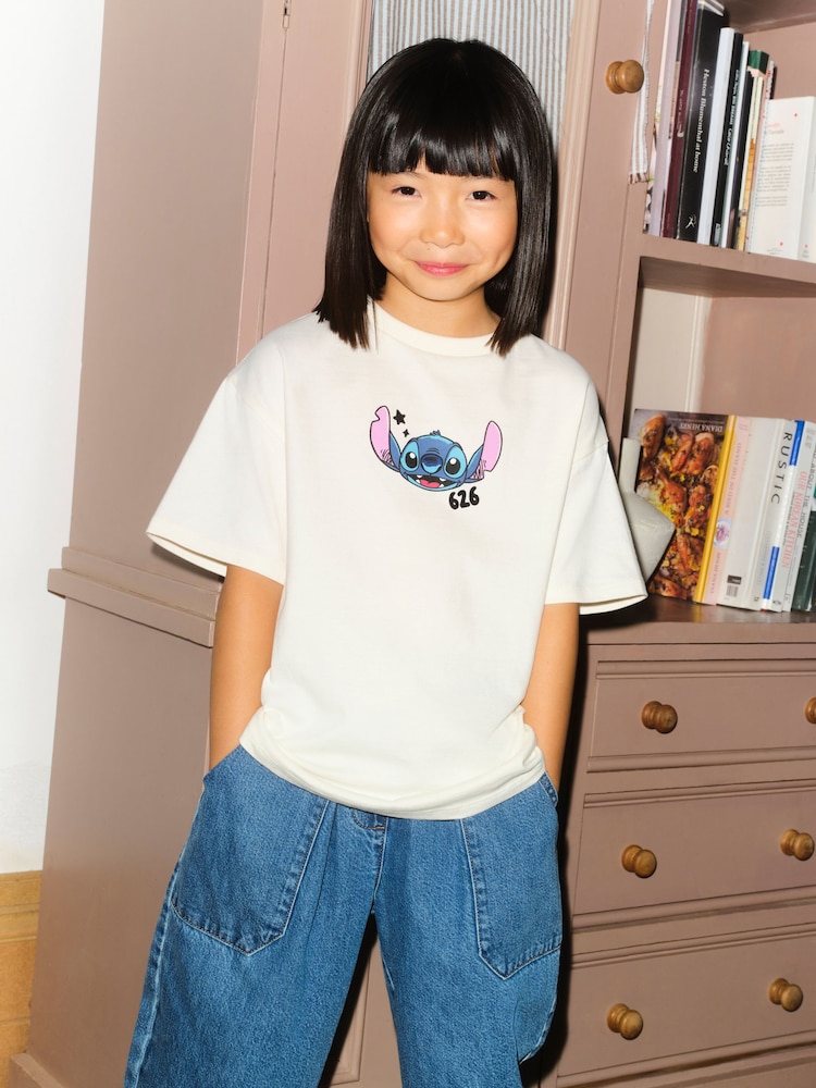 Ecru Lilo & Stitch Oversized Graphic T-Shirt (3-16yrs) - Image 1 of 9 Ecru Lilo & Stitch Oversized Graphic T-Shirt (3-16yrs) - Image 1 of 9