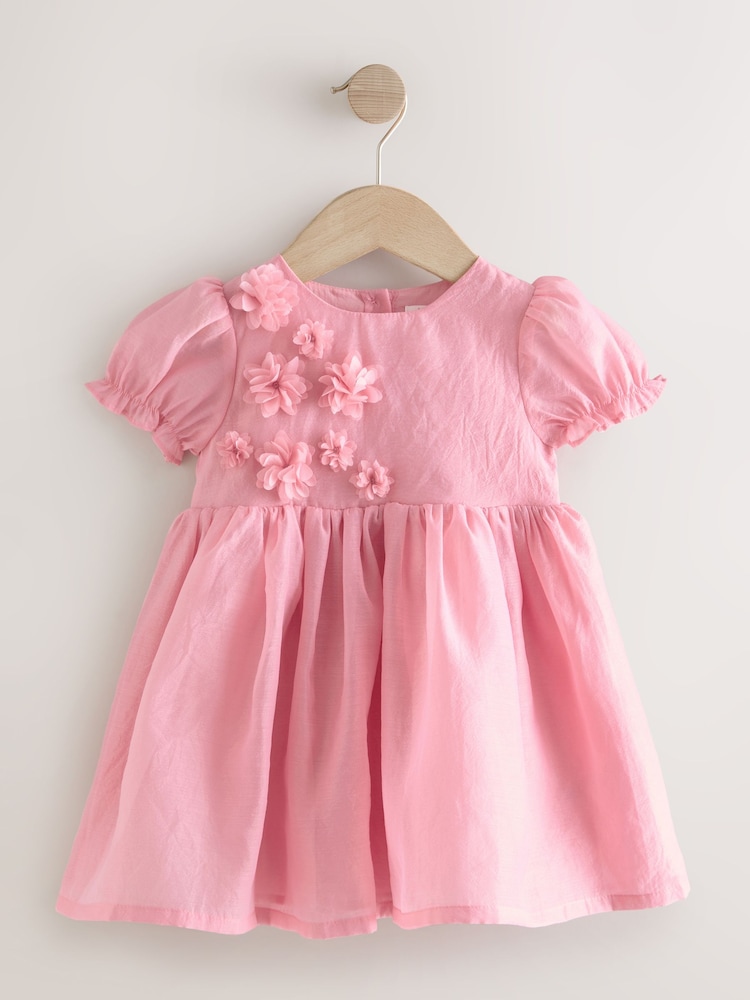 وردي - فستان كورساج بتصميم ورود للبنات (للأعمار من 3 أشهر إلى 8 سنوات) - صورة 1 من 4 وردي - فستان كورساج بتصميم ورود للبنات (للأعمار من 3 أشهر إلى 8 سنوات) - صورة 1 من 4