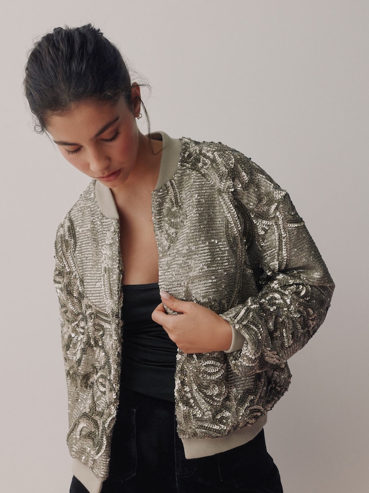 Srebrne bleščice - Pilotska jakna - Slika 1 iz 5 Srebrne bleščice - Pilotska jakna - Slika 1 iz 5