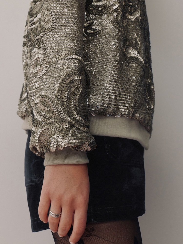 Srebrne bleščice - Pilotska jakna - Slika 5 iz 5 Srebrne bleščice - Pilotska jakna - Slika 5 iz 5